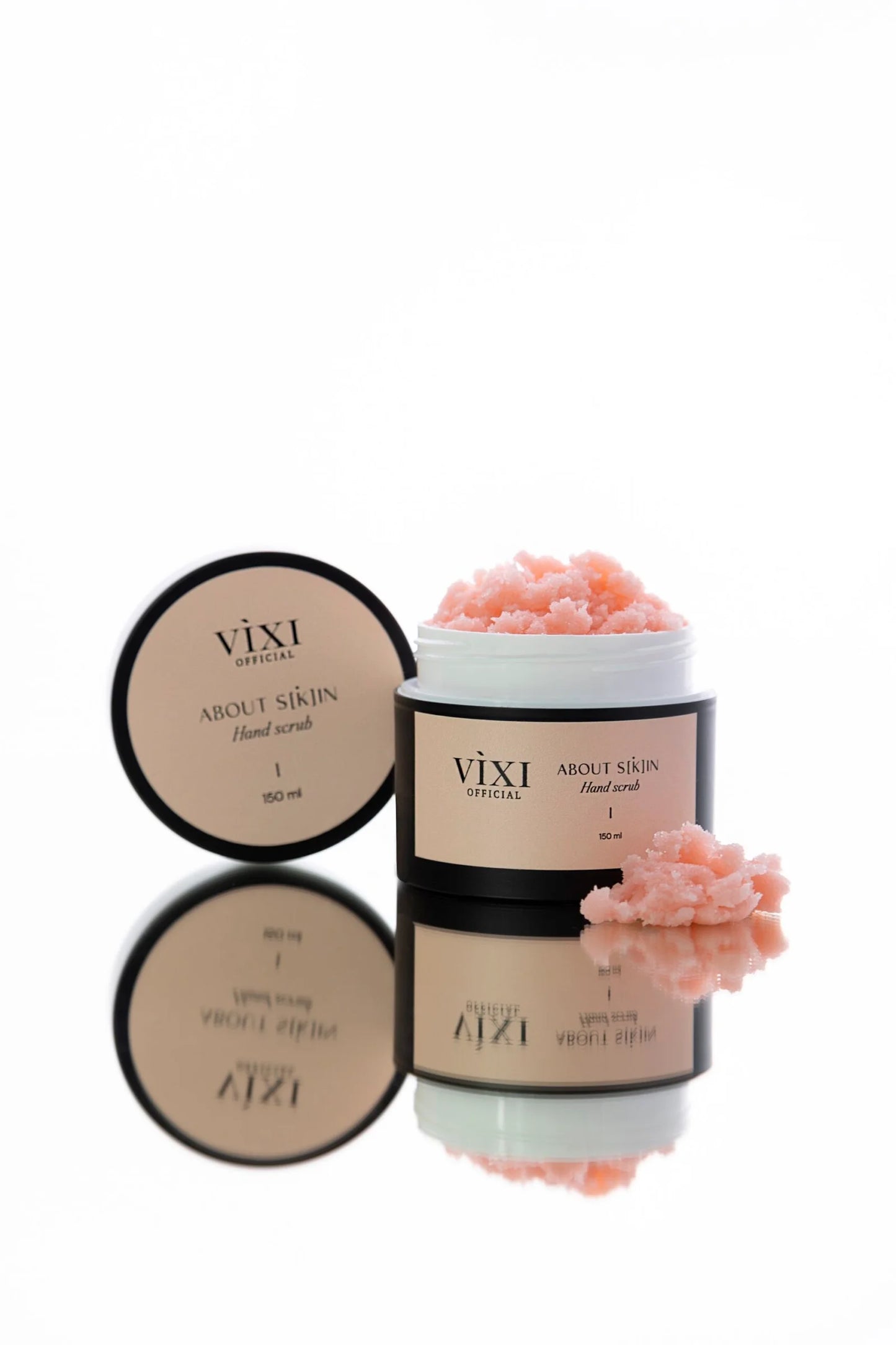 Vixi skincare products with pink flowers on a white background
