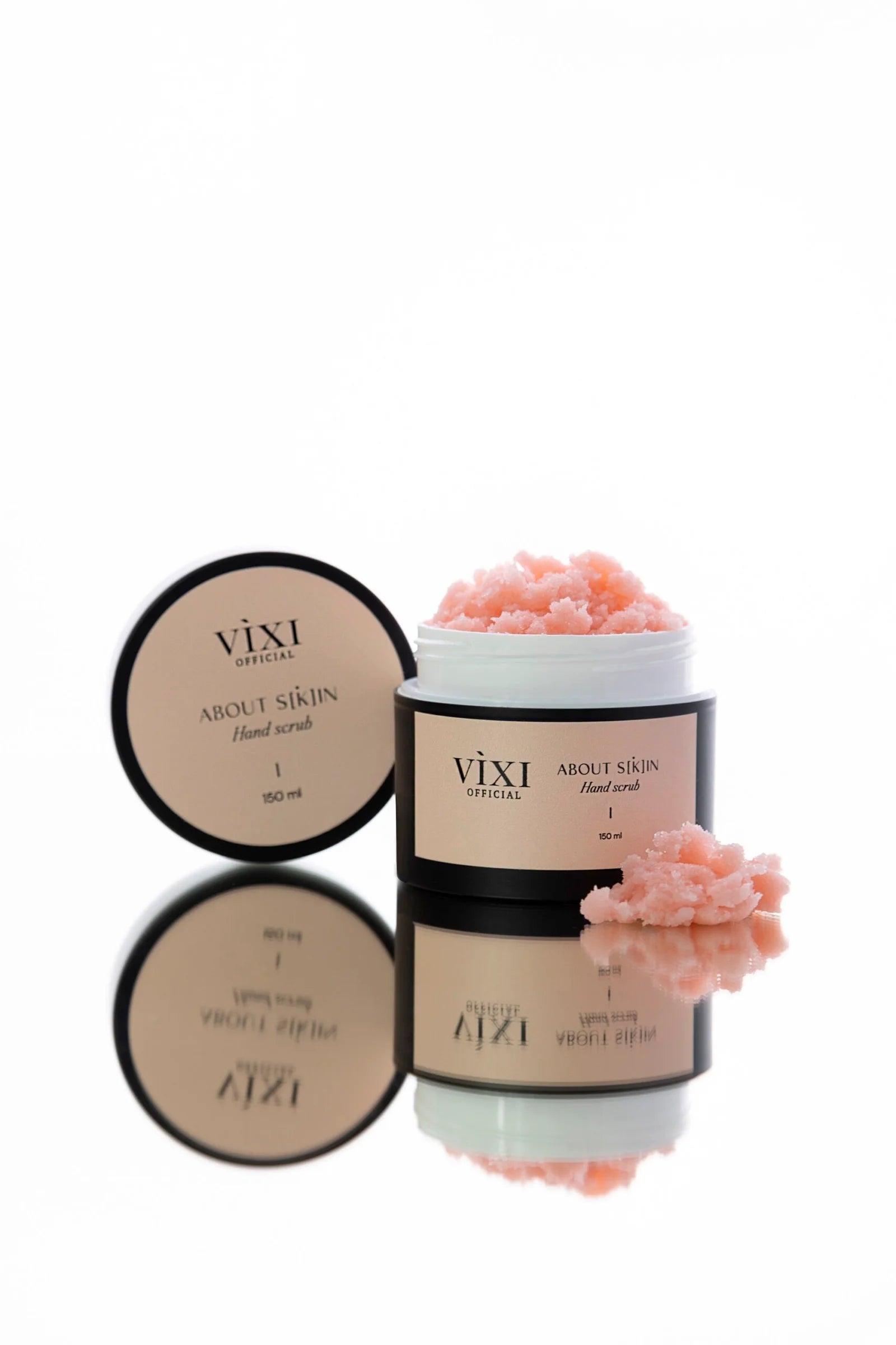 Vixi skincare products with pink flowers on a white background